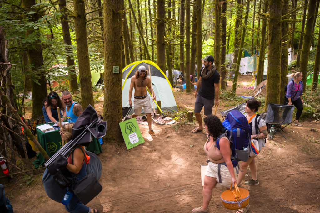 2023 Pickathon campers pass a trail tool provider along the Logging Road during setup Friday morning. Photo by Rob Kerr @robkerr6. camping